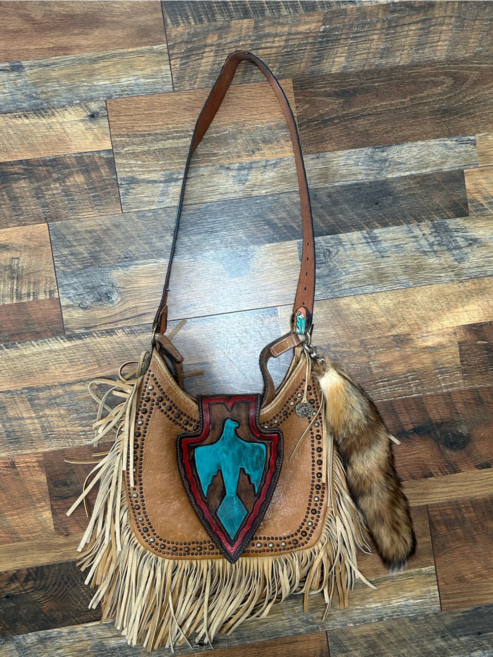 Fringed Leather Crossbody Bag with Turquoise Shield Accent